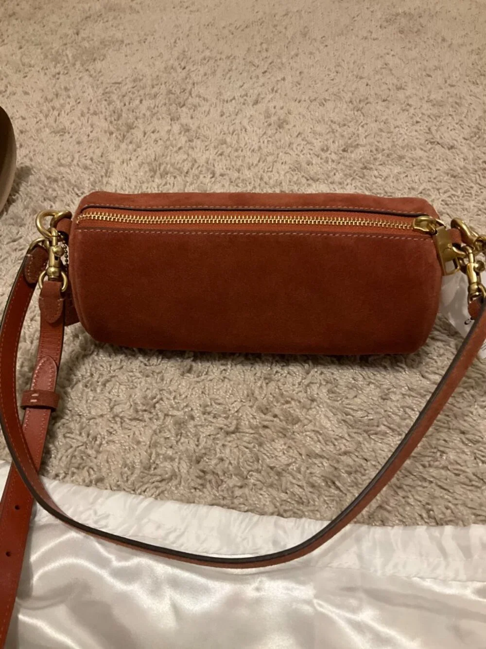 COACH barrel bag. brass/clay. CDy81.
